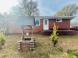 619 Jones Street Monroe, NC 28110 - Photo 1 of 6 a front view of a house with garden