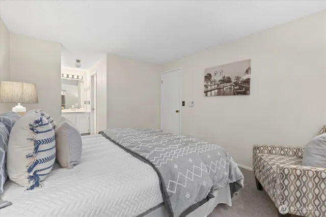 a bedroom with a bed and a couch