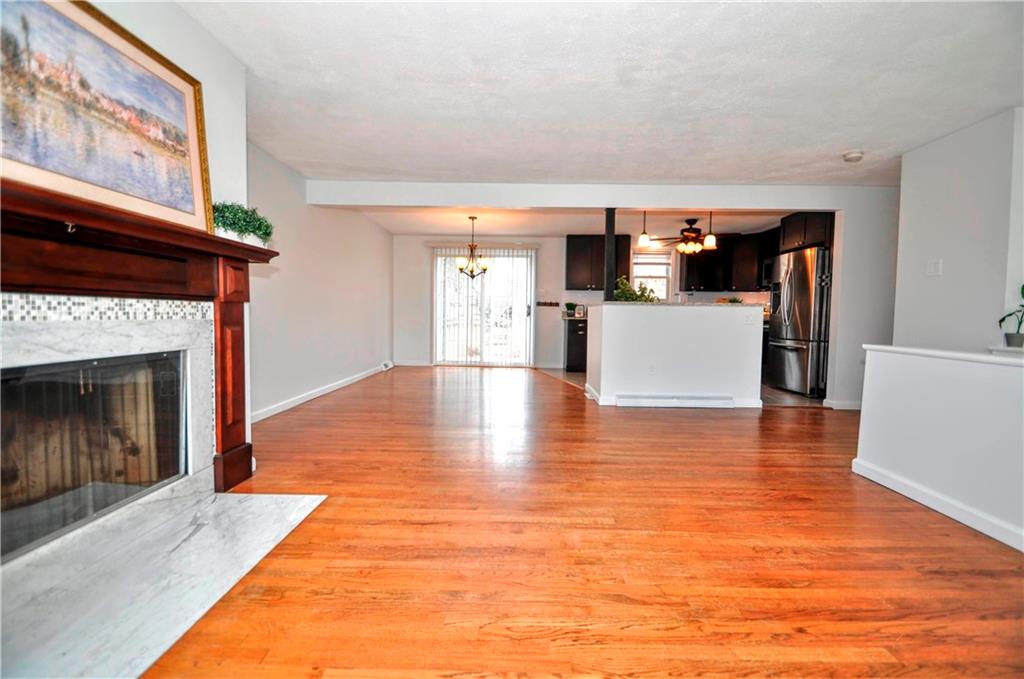 1313 Star Ridge Drive Pittsburgh, PA 15241 - Photo 8 of 36 a view of empty room with kitchen and fireplace