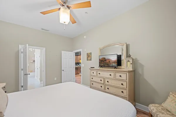 a bedroom with a bed and a dresser
