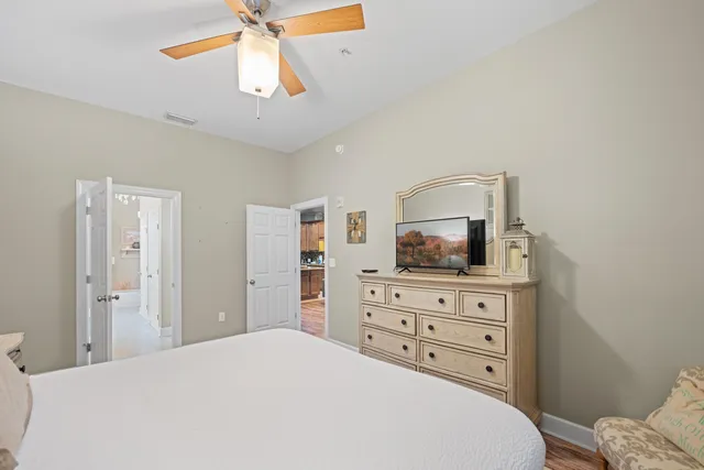 a bedroom with a bed and a dresser