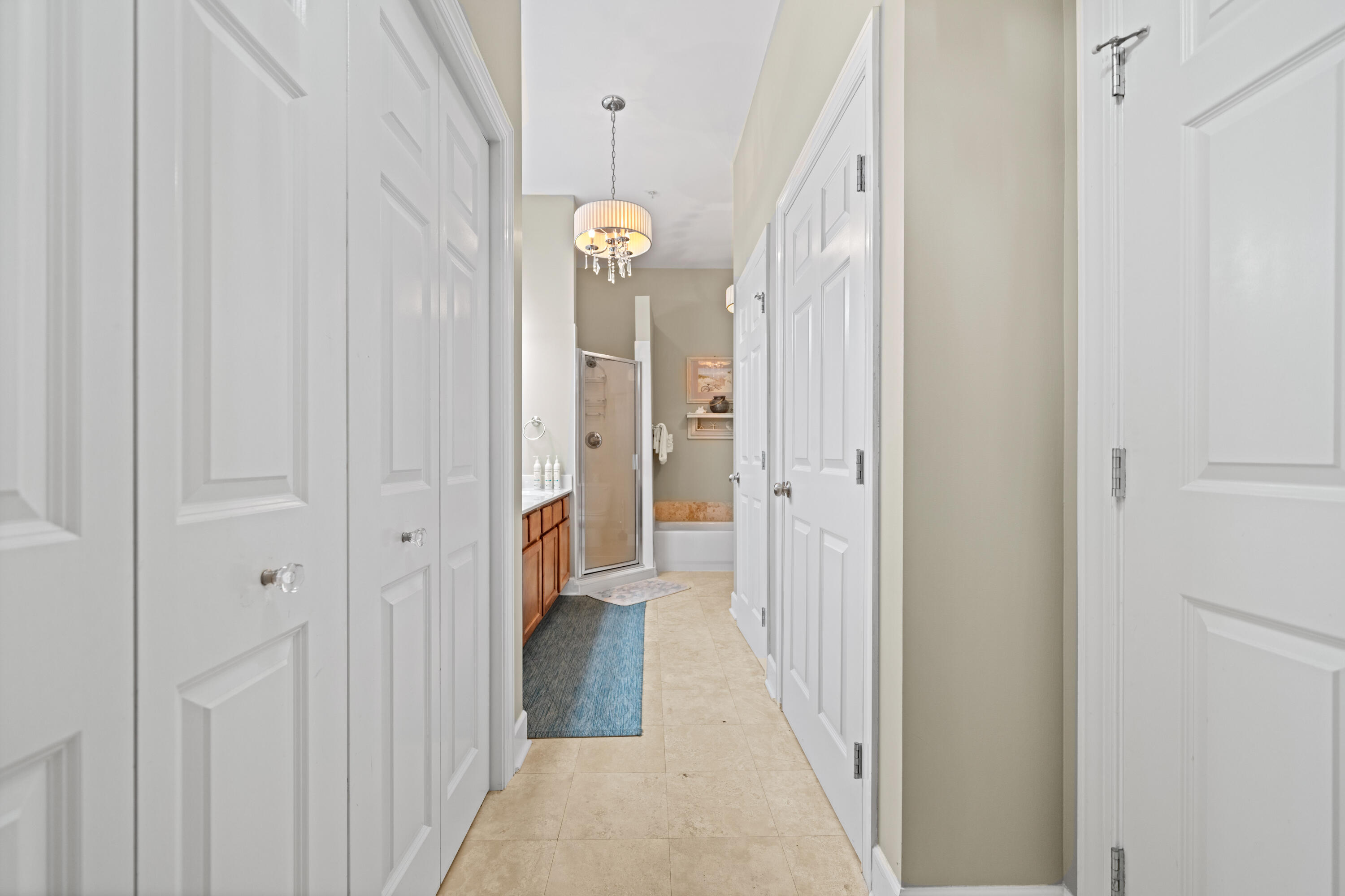 231 Somerset Bridge Road, Unit 2205 Santa Rosa Beach, FL 32459 - Photo 16 of 37 a view of a hallway with wooden floor and a bathroom