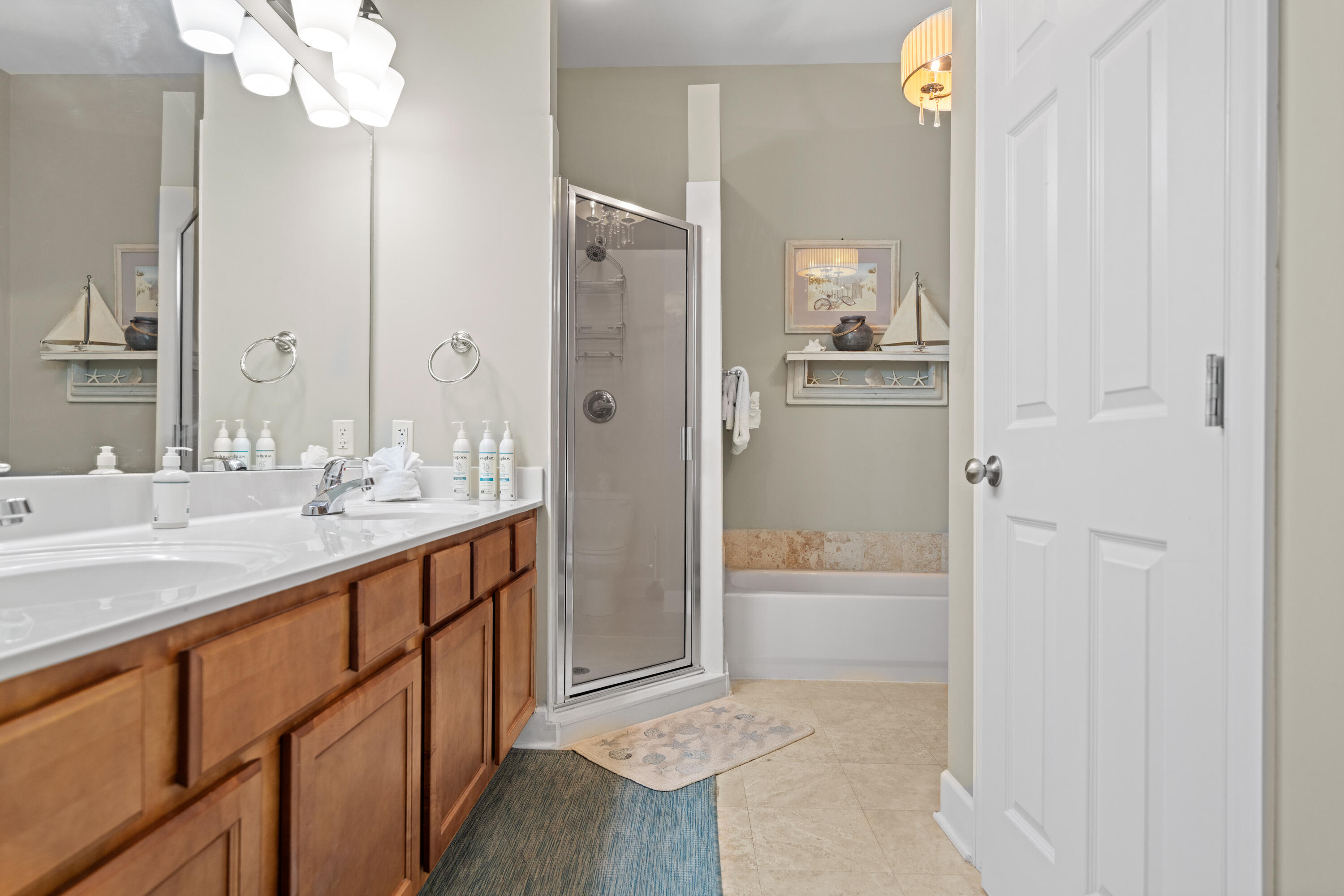 231 Somerset Bridge Road, Unit 2205 Santa Rosa Beach, FL 32459 - Photo 17 of 37 a bathroom with a granite countertop sink mirror and a bathtub