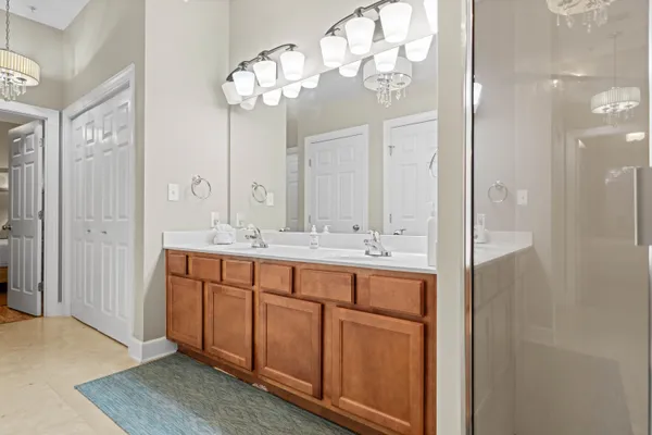 a bathroom with a double vanity sink and a mirror