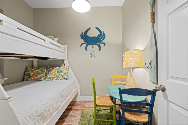 a bedroom with a bed and a chair