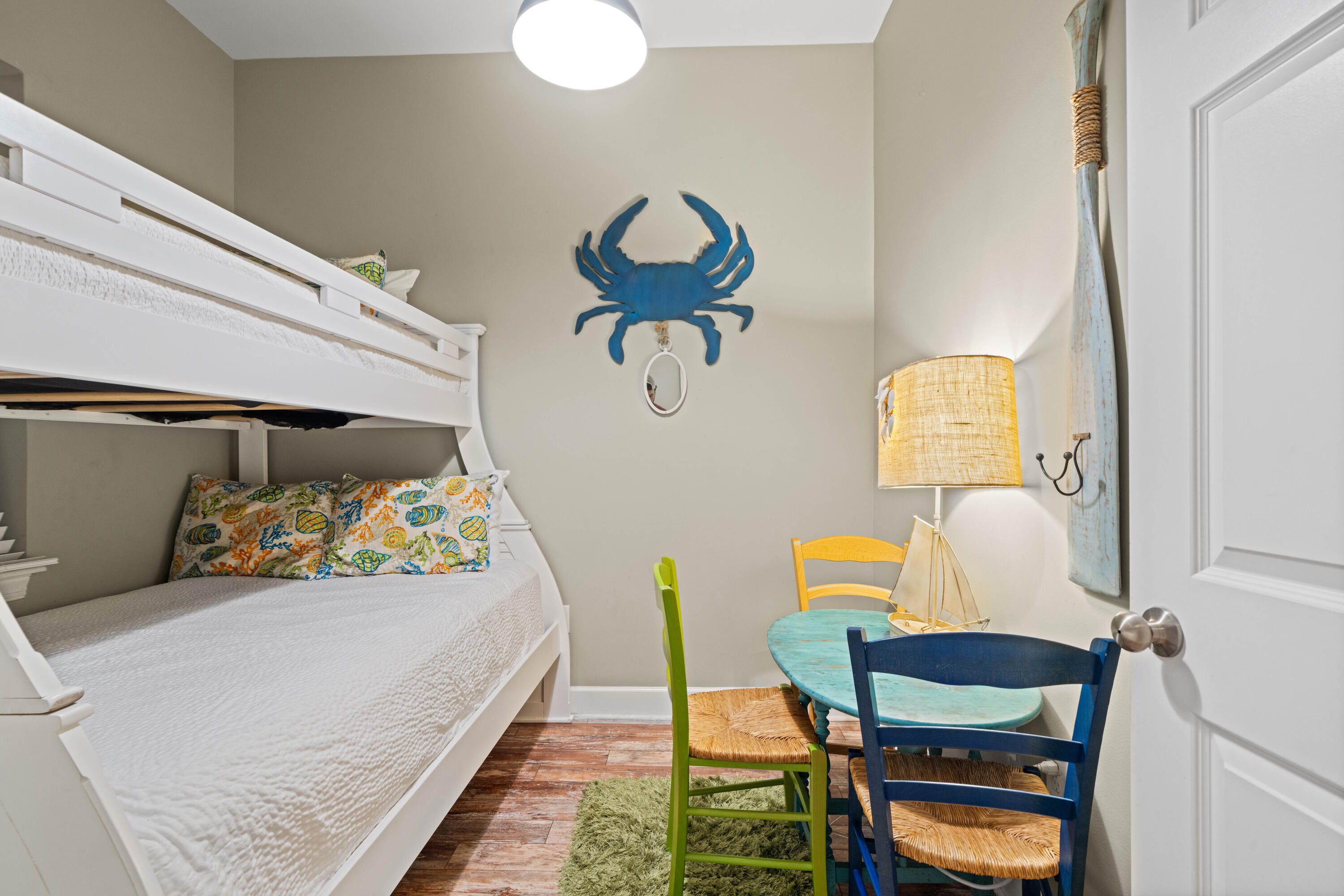 231 Somerset Bridge Road, Unit 2205 Santa Rosa Beach, FL 32459 - Photo 23 of 37 a bedroom with a bed and a chair