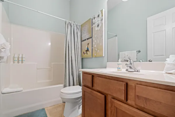a bathroom with a sink a toilet and a bathtub