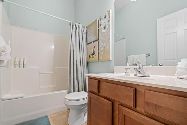 a bathroom with a sink a toilet and a bathtub