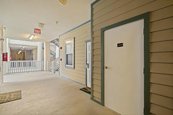 a view of a hallway with a livingroom