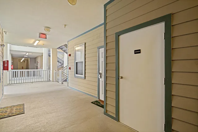 a view of a hallway with a livingroom