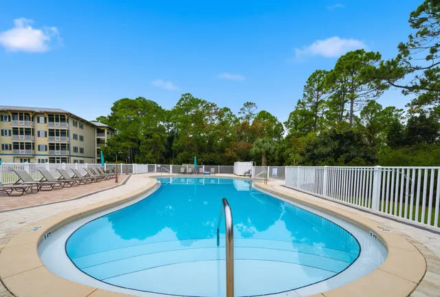 a view of a swimming pool with a patio