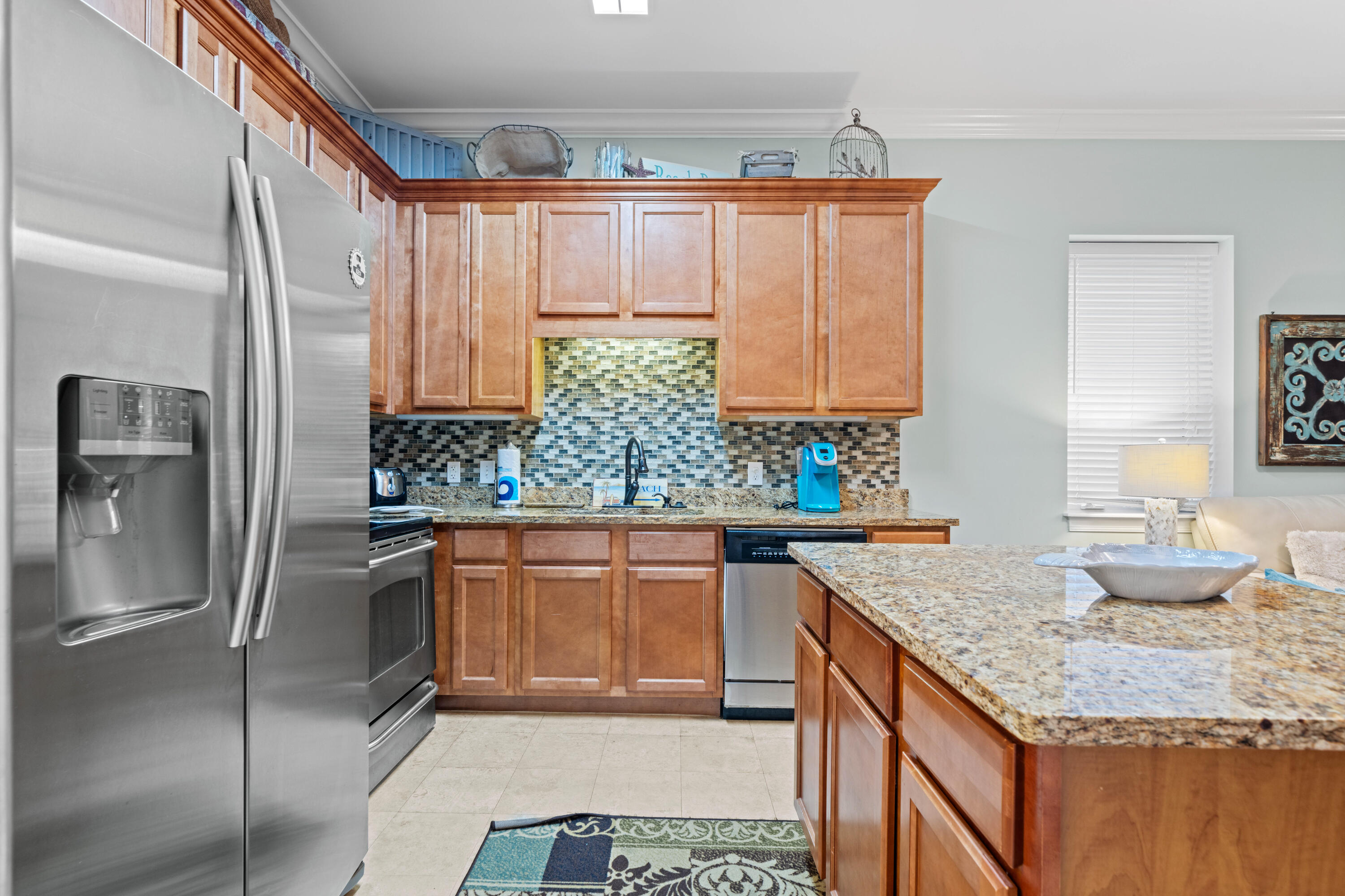 231 Somerset Bridge Road, Unit 2205 Santa Rosa Beach, FL 32459 - Photo 8 of 37 a kitchen with stainless steel appliances granite countertop a sink stove and refrigerator
