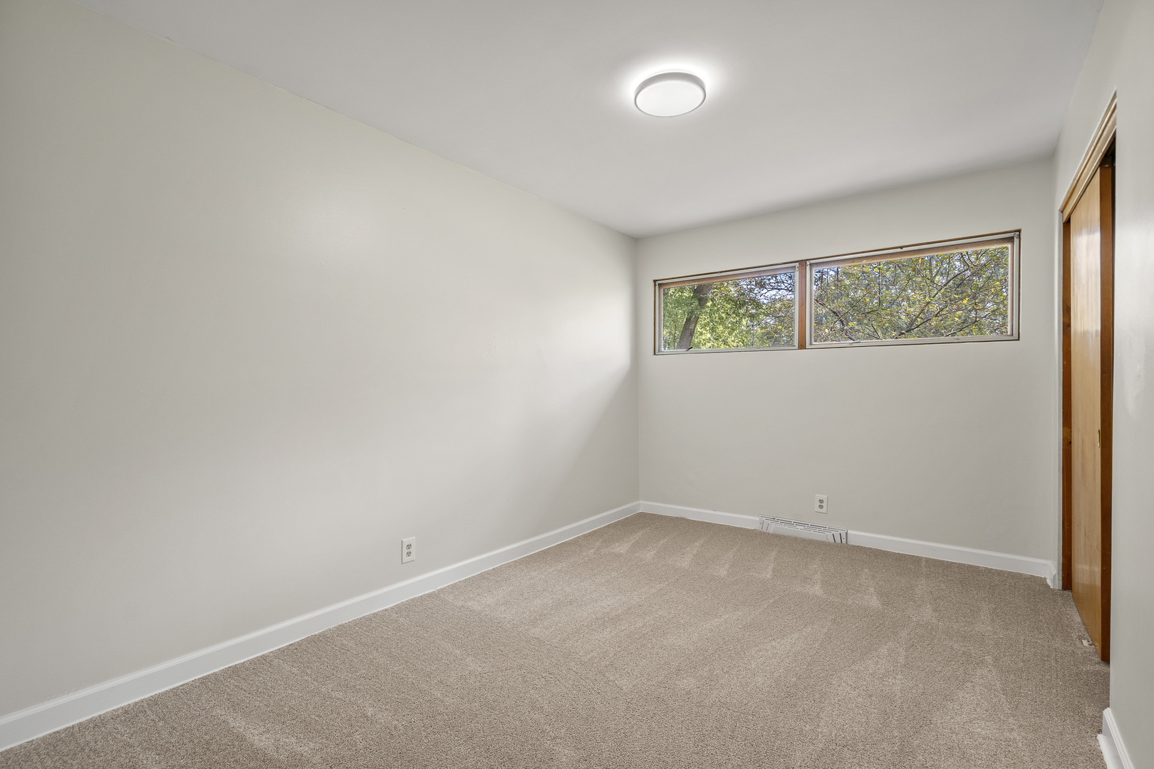 7S174 Wild Cherry Road Naperville, IL 60540 - Photo 13 of 25 an empty room with windows