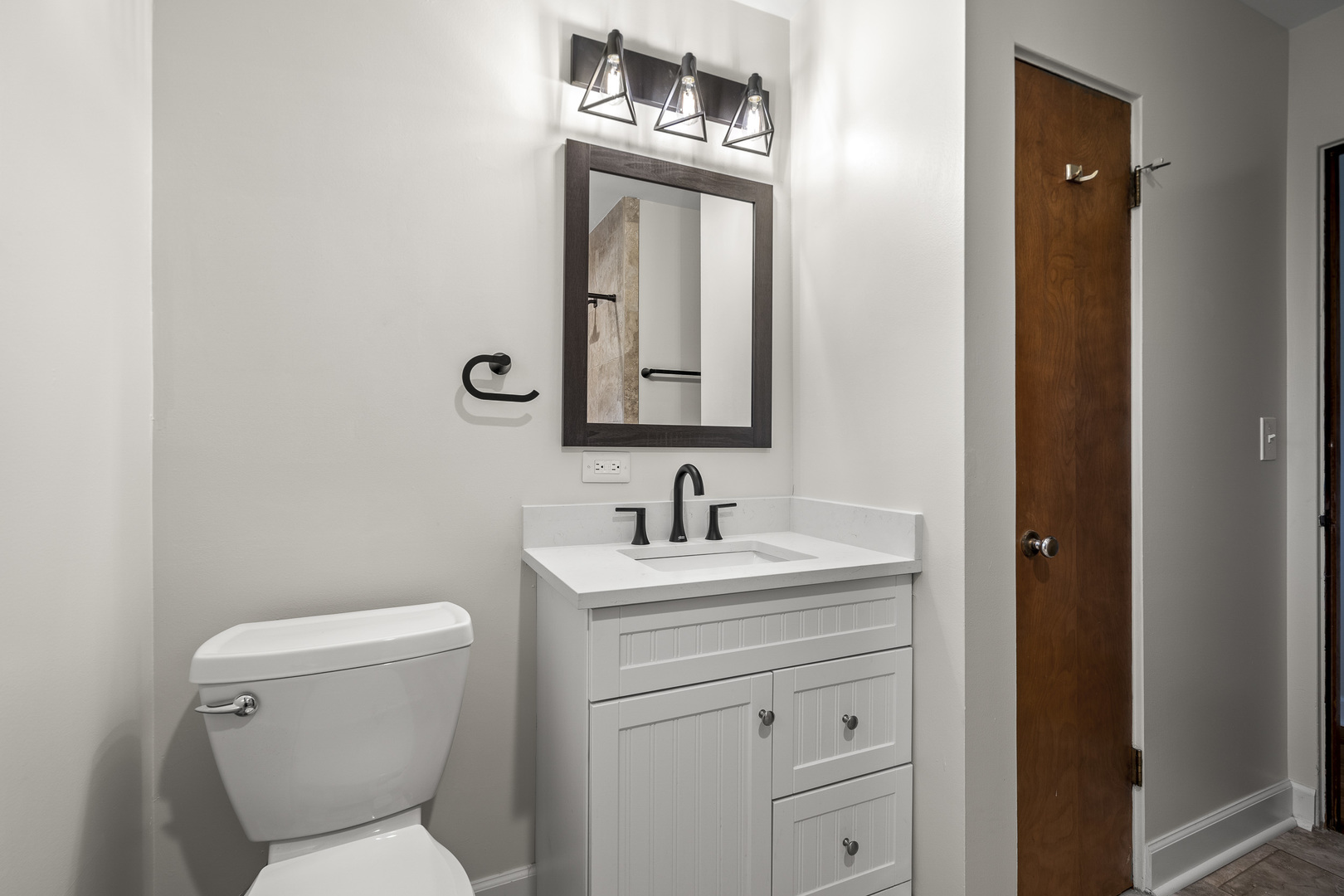 7S174 Wild Cherry Road Naperville, IL 60540 - Photo 14 of 25 a bathroom with a toilet a sink a vanity and mirror
