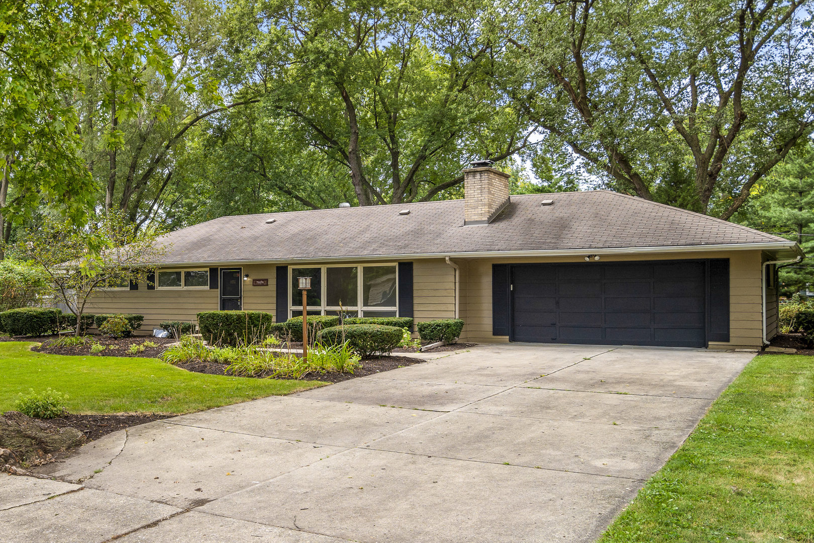 7S174 Wild Cherry Road Naperville, IL 60540 - Photo 2 of 25 a front view of a house with garden