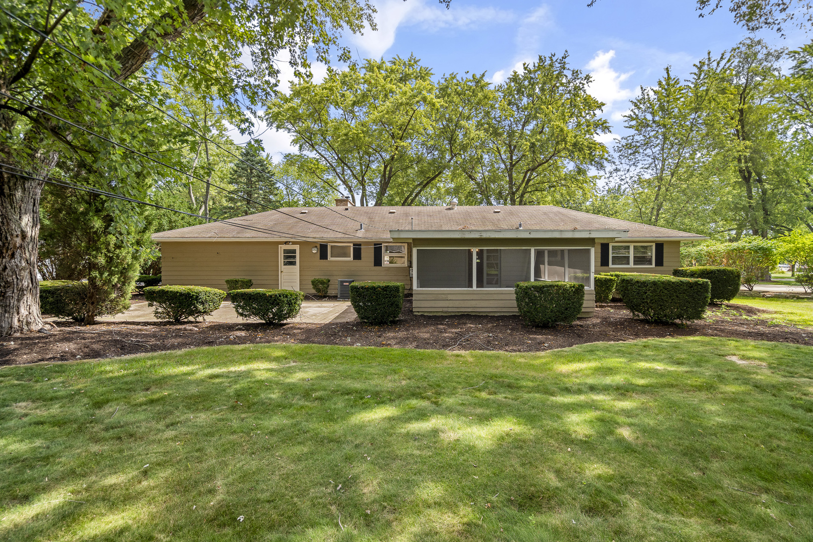 7S174 Wild Cherry Road Naperville, IL 60540 - Photo 22 of 25 a front view of a house with a yard porch and sitting area