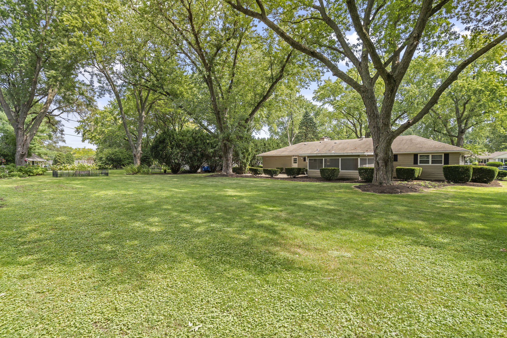 7S174 Wild Cherry Road Naperville, IL 60540 - Photo 24 of 25 a front view of house with yard and green space