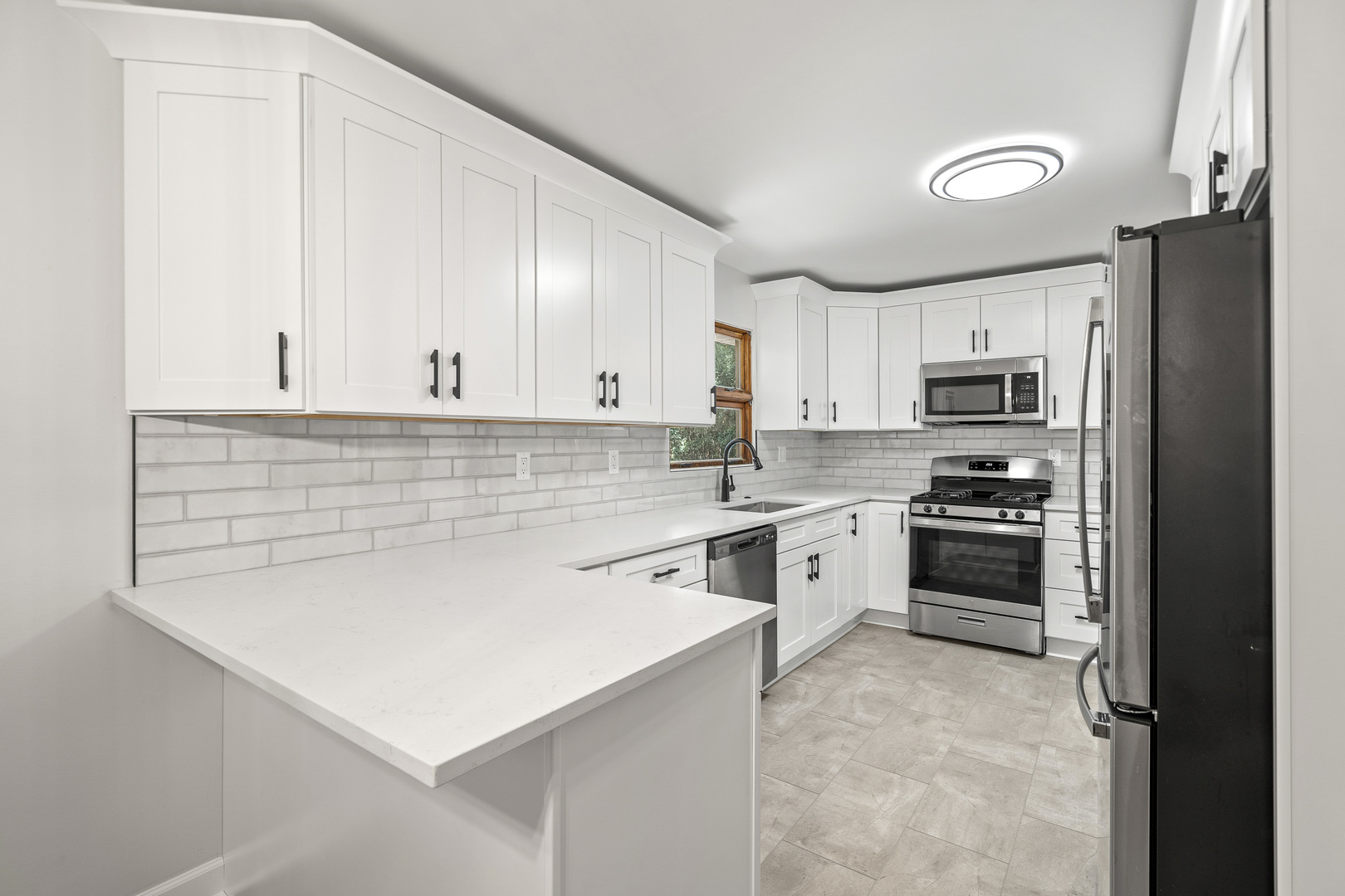 7S174 Wild Cherry Road Naperville, IL 60540 - Photo 7 of 25 a white kitchen with granite countertop white cabinets and stainless steel appliances