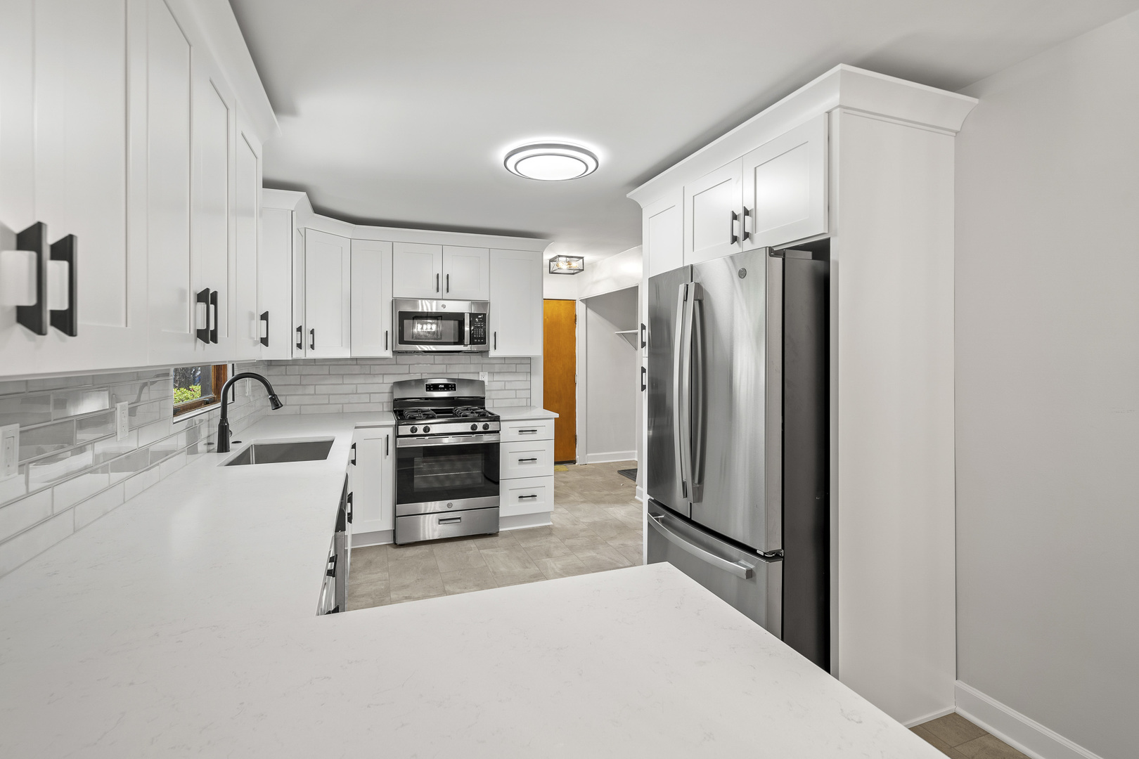 7S174 Wild Cherry Road Naperville, IL 60540 - Photo 8 of 25 a kitchen with granite countertop a refrigerator and a sink