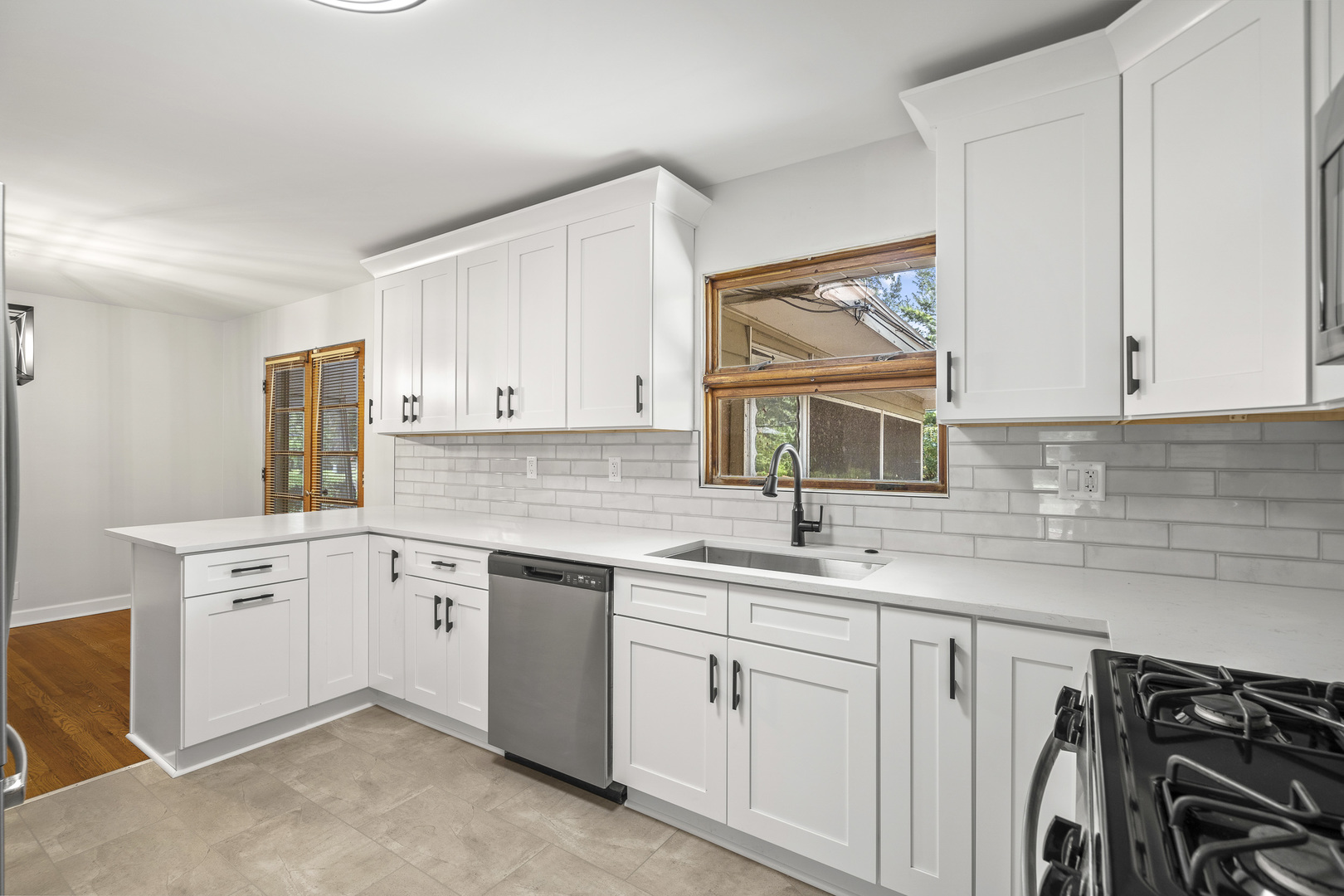 7S174 Wild Cherry Road Naperville, IL 60540 - Photo 9 of 25 a kitchen with a sink cabinets and window