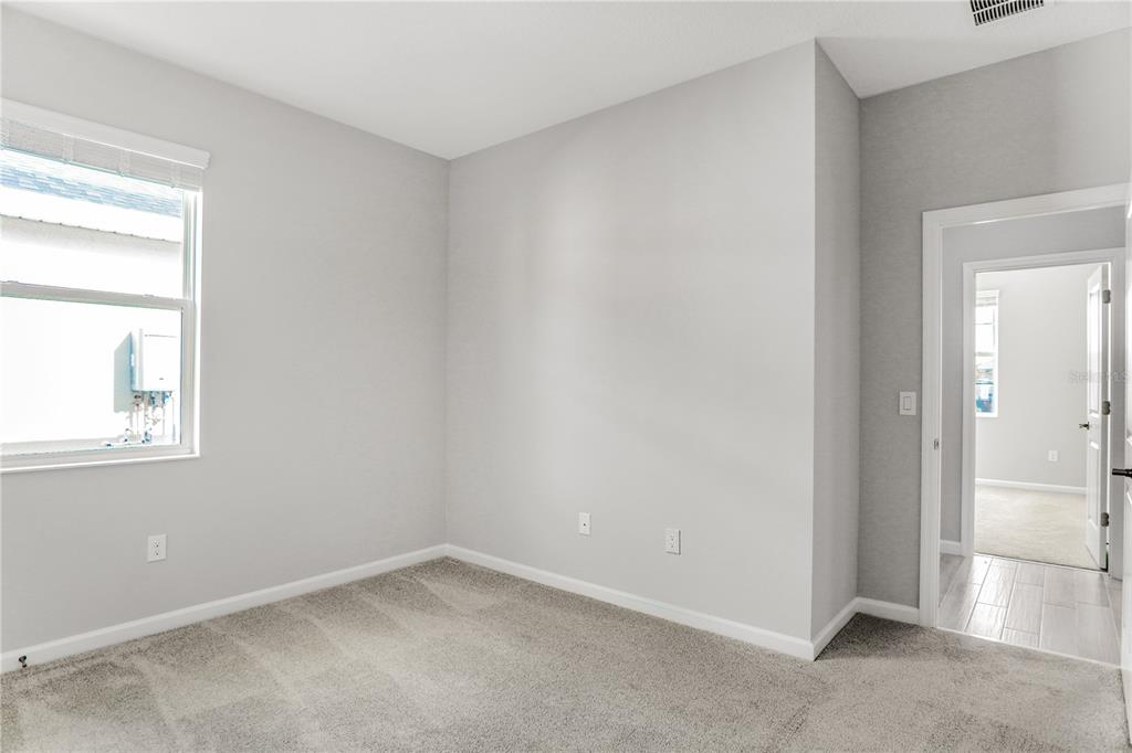 5286 Teirgarten Street St. Cloud, FL 34771 - Photo 11 of 26 an empty room with windows and closet