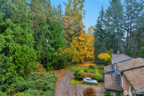 an aerial view of house with yard swimming pool and outdoor seating