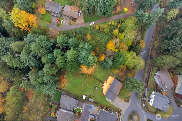 an aerial view of a house with a lake view