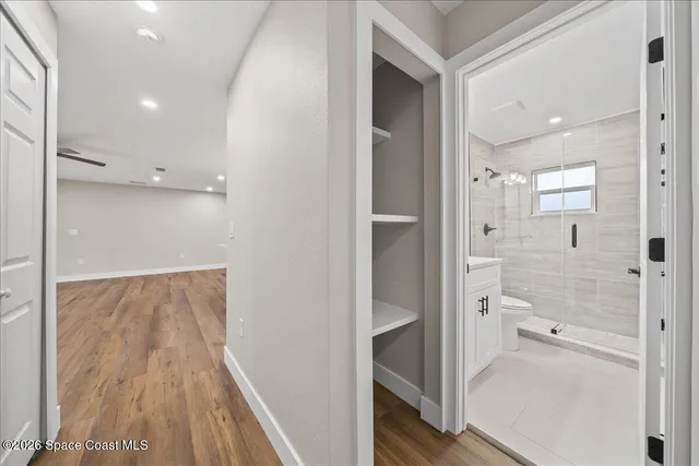 a bathroom with a glass shower door