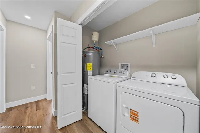 a view of storage and utility room with washer and dryer