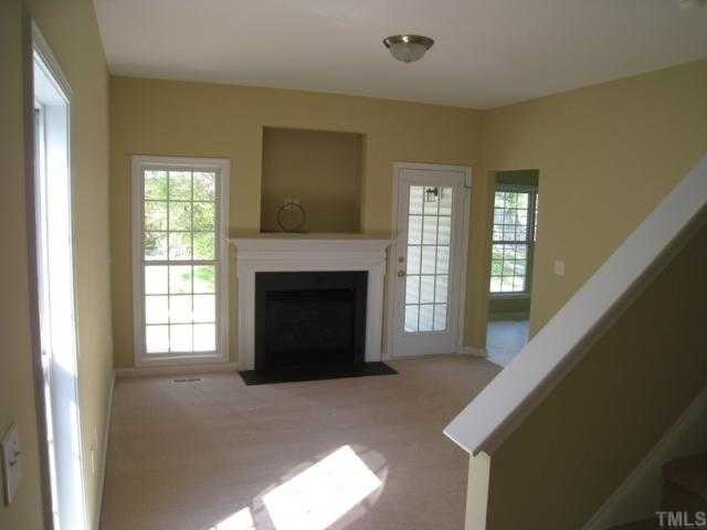 Family room offers gas log fireplace with TV niche & custom mantle, brushed nickel lighting!