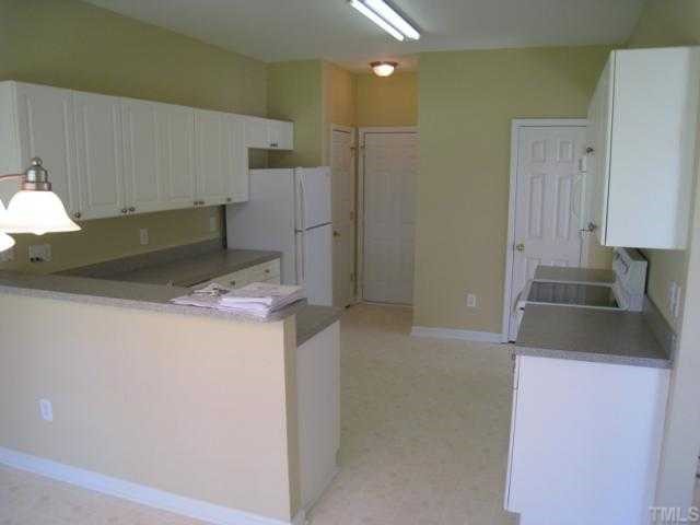 Kitchen also has fridge, tons of countertop space, barstool area!