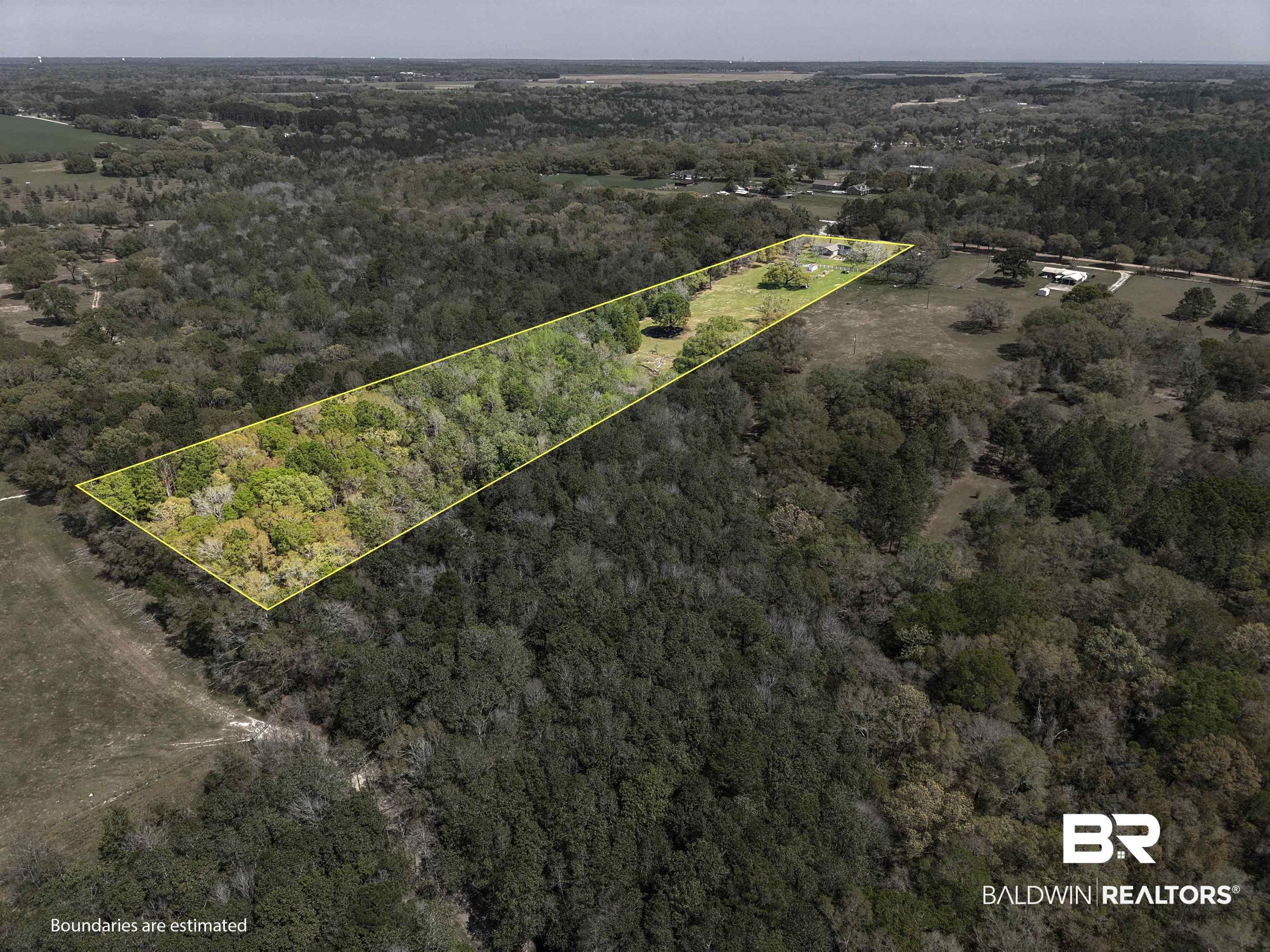 11100 Rhett McConnell Road Theodore, AL 36582 - Photo 27 of 47 Aerial view of property's location featuring a forest and property boundaries highlighted