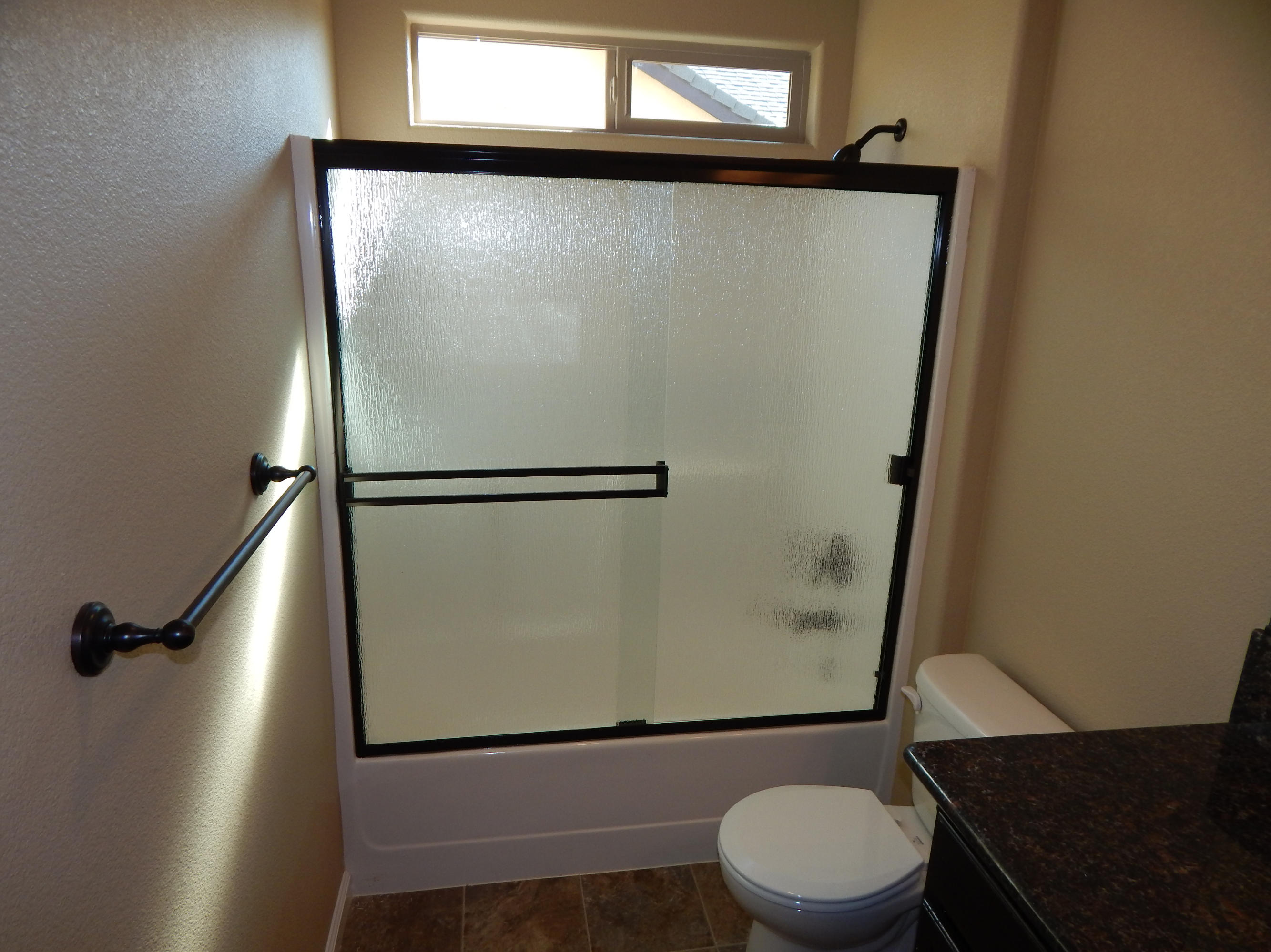 3531 Archer Road Igo, CA 96047 - Photo 9 of 34 a bathroom with a granite countertop sink toilet and shower