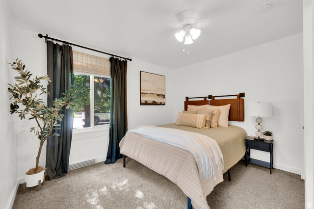 446 South 300 East Provo, UT 84606 - Photo 21 of 32 Carpeted bedroom featuring white walls and a ceiling fan with integrated lighting