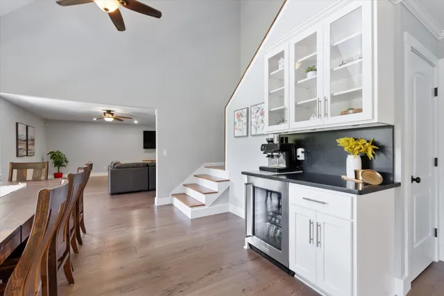 a view of a dining room with furniture and a kitchen