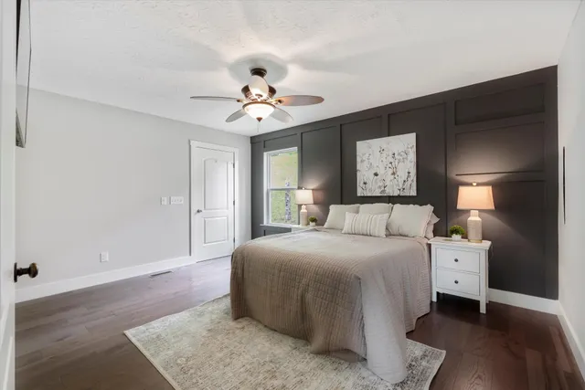 a bed room with a bed and a chandelier