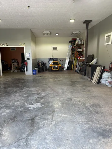 a view of a balcony with chairs and wooden floor