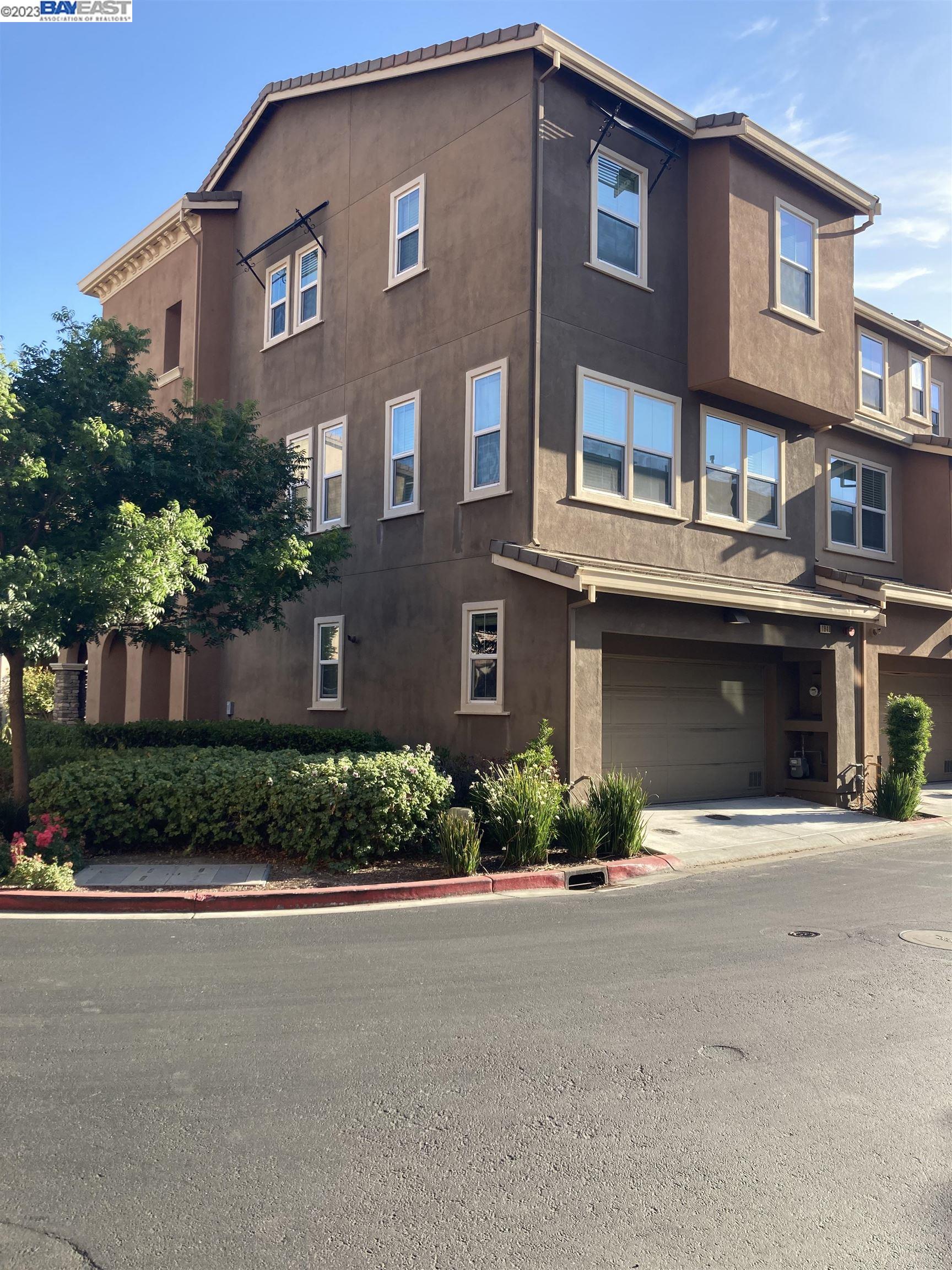 1940 Lee Way Milpitas, CA 95035 - Photo 11 of 11 a front view of a house with a yard and garage