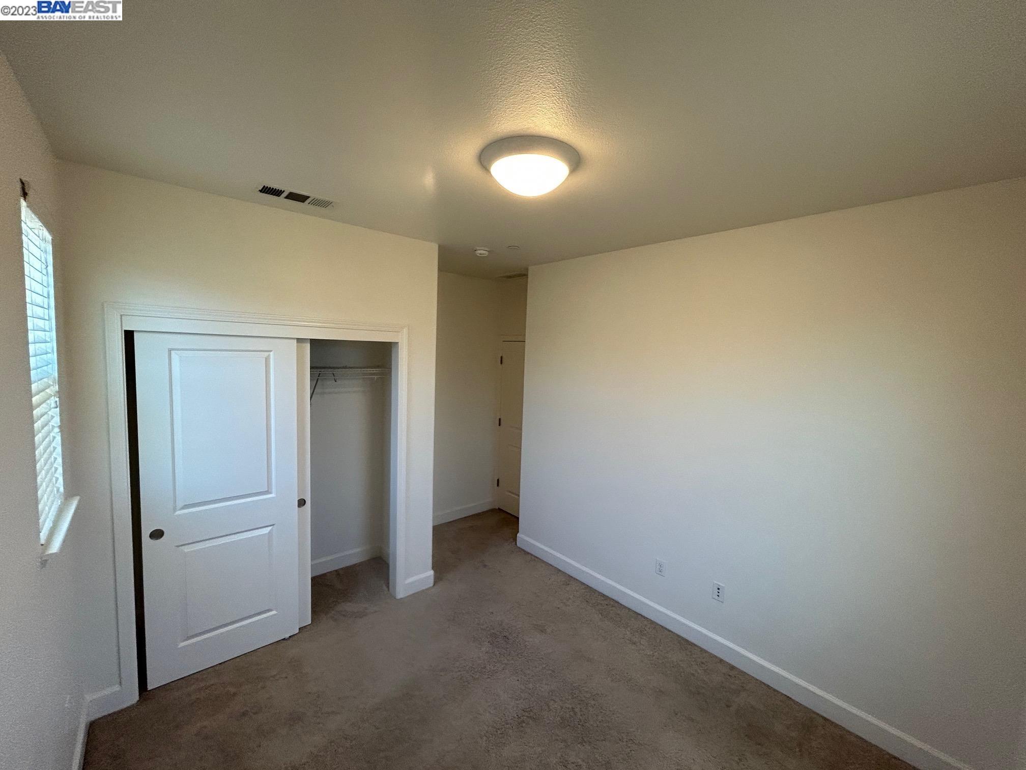 1940 Lee Way Milpitas, CA 95035 - Photo 6 of 11 an empty room with closet area