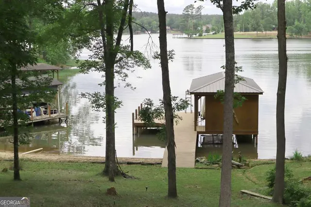 a front view of a house with a lake view