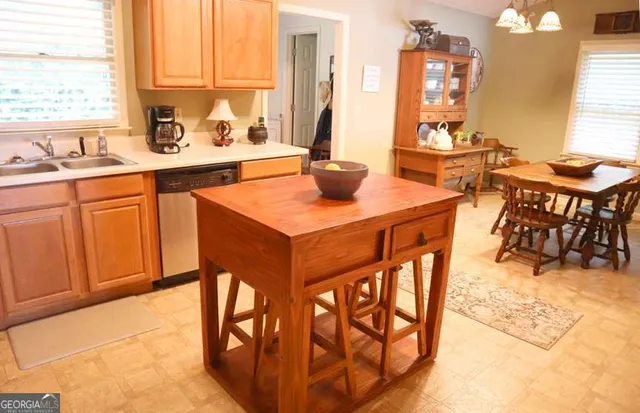 a view of a kitchen area with furniture and window