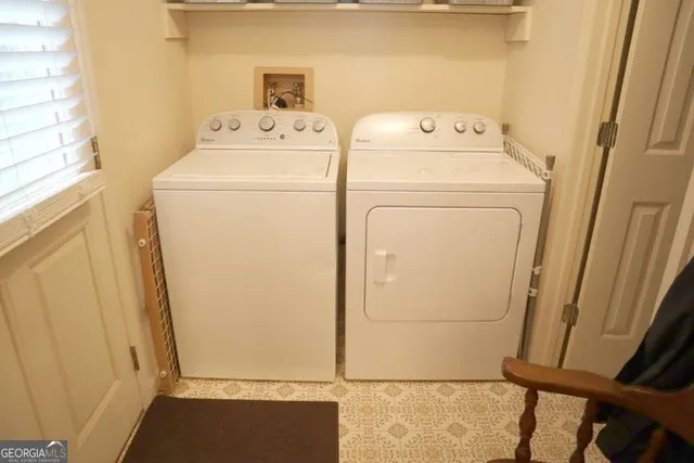 a utility room with dryer and washer