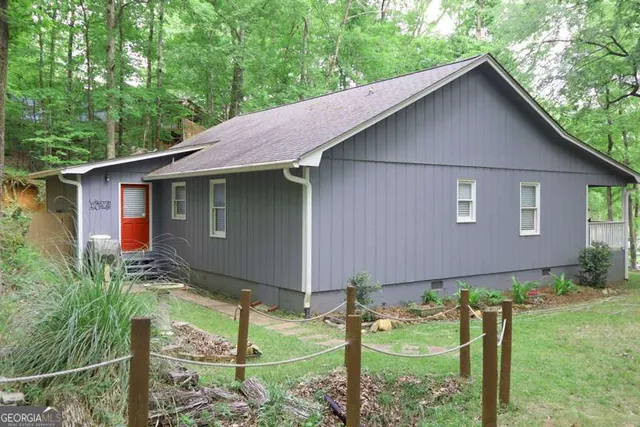 a backyard of a house with lots of green space