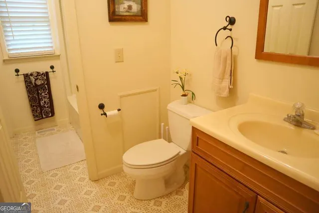 a bathroom with a sink and a toilet