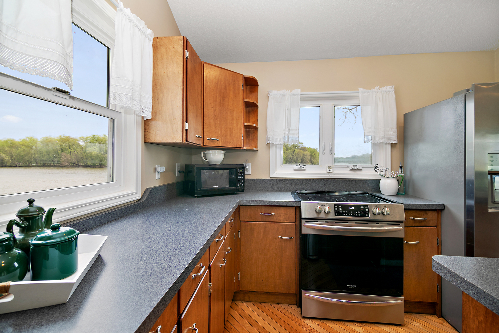 3119 River Road Kankakee, IL 60901 - Photo 13 of 39 a kitchen with stainless steel appliances granite countertop a stove a sink and a microwave