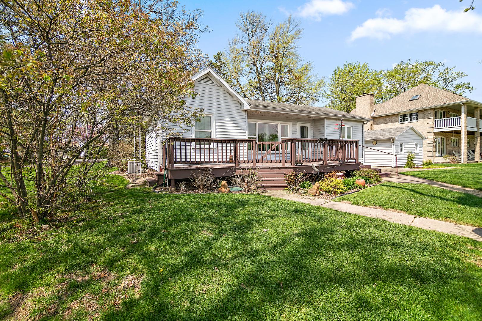 3119 River Road Kankakee, IL 60901 - Photo 23 of 39 a front view of a house with a yard table and chairs