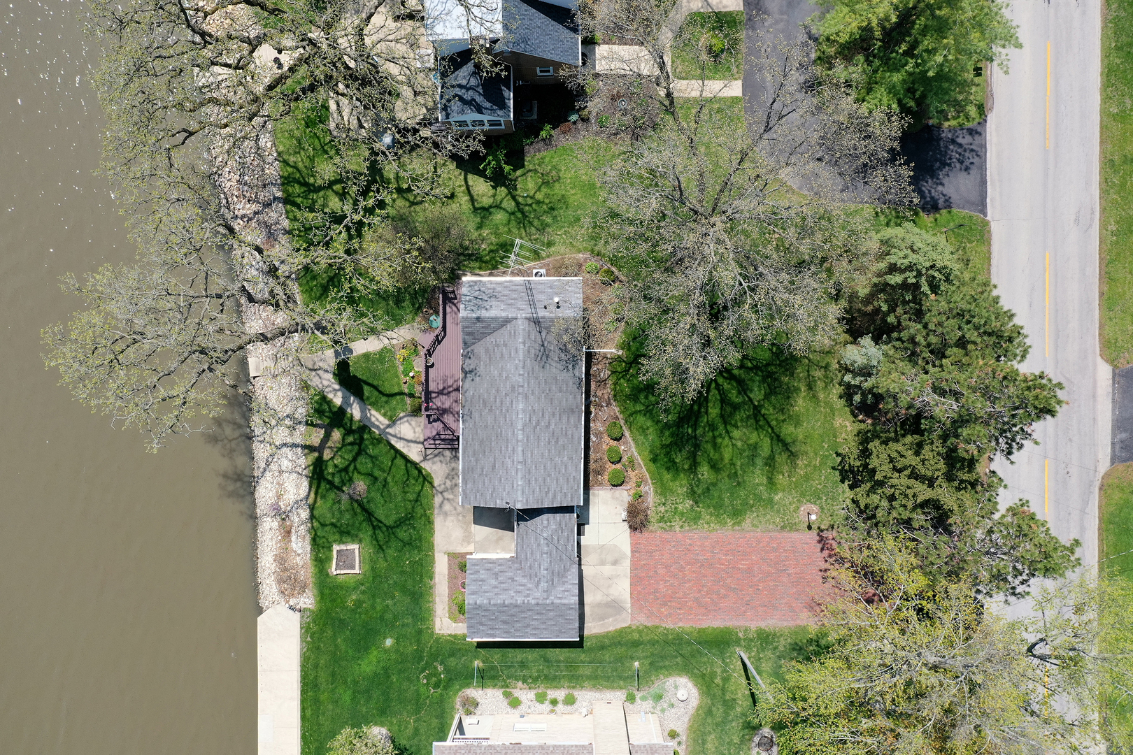 3119 River Road Kankakee, IL 60901 - Photo 30 of 39 an aerial view of a house with a yard and trees all around