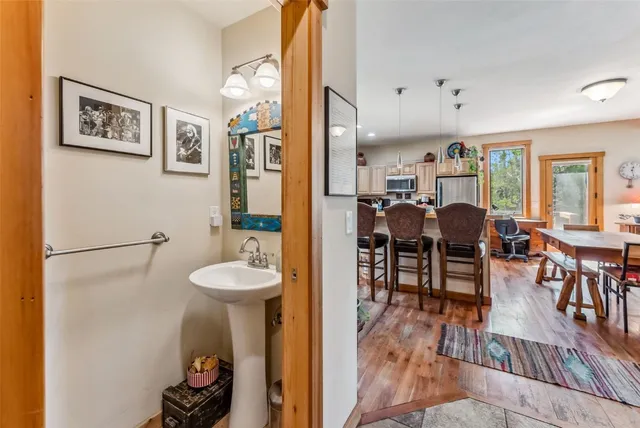 a view of a dining room with furniture and wooden floor