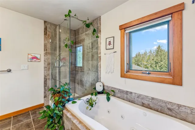 a bathroom with a toilet a sink and a mirror
