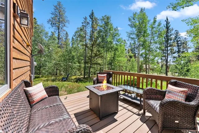 a view of a terrace with a table and chairs